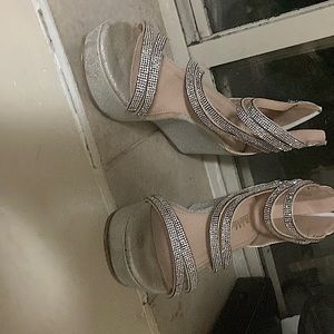 Tall silver glitter shoes brand Bella Marie